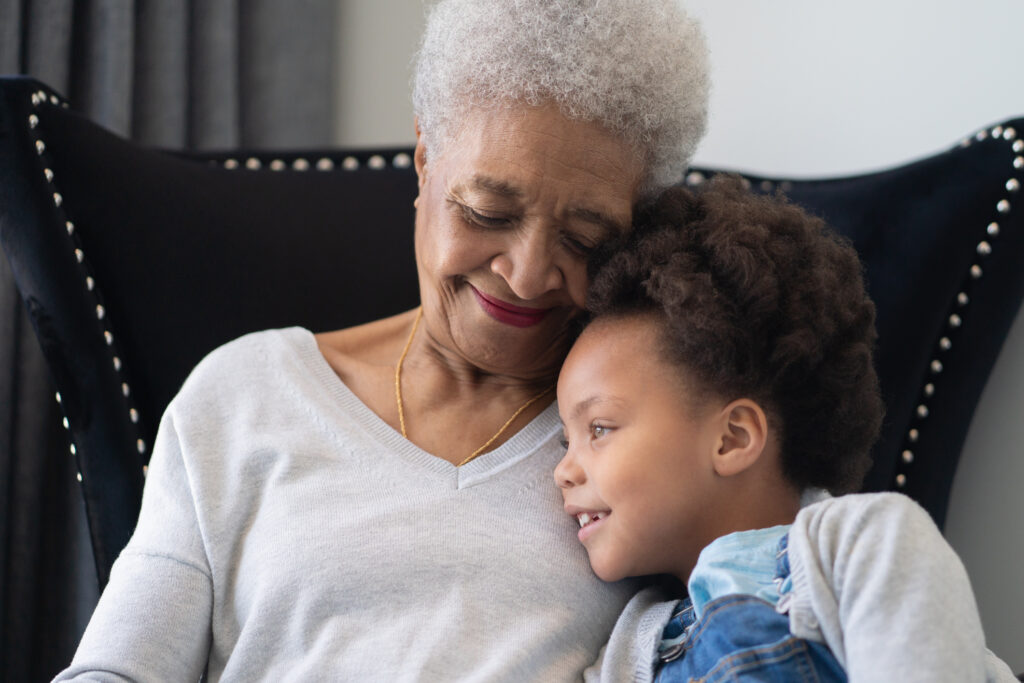 grandparent sitting with grandchild