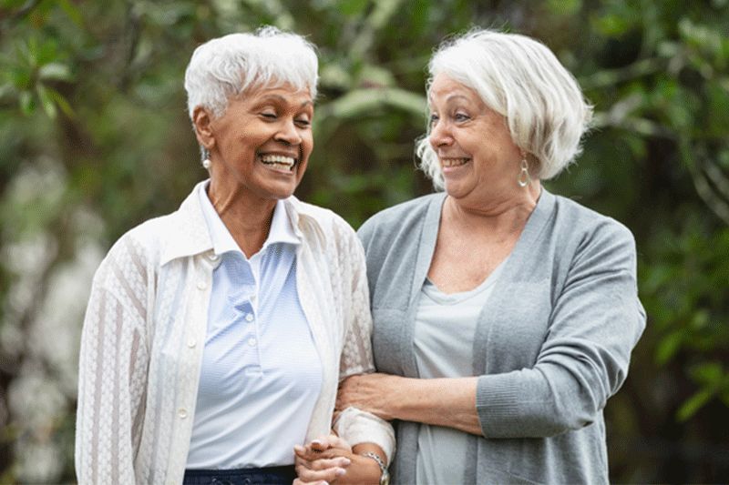 A woman takes a stroll while she is visiting a person with dementia.